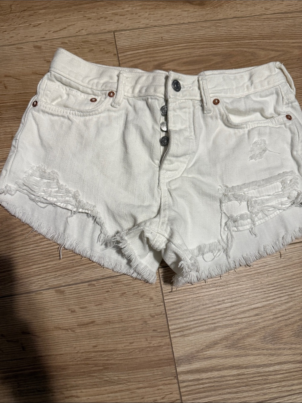 We The Free White Distressed Button-Fly Denim Shorts